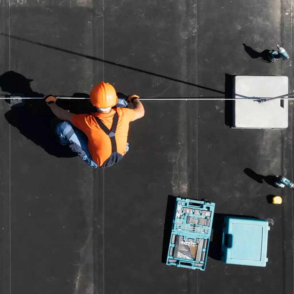 Roofer repairing roof.